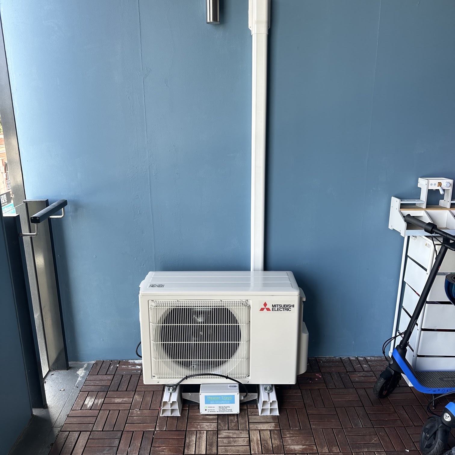 Split system outdoor unit installed on a Melbourne apartment balcony